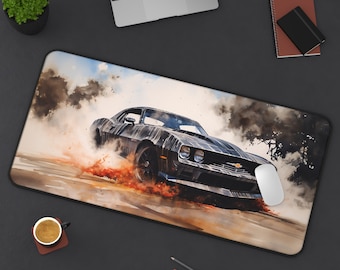 May include: A black muscle car with a smoky background. The car is driving on a dirt road and leaving tire tracks behind it. The car has a black paint job and a chrome bumper. The car is a classic American muscle car.