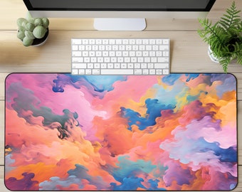 Puede incluir: Alfombrilla de ratón con diseño abstracto de nubes de colores en tonos rosa, azul, amarillo y naranja.