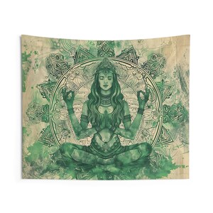 May include: Green tapestry featuring a woman meditating in a lotus position within a circular mandala design. The woman has long flowing hair and is wearing a crown and jewelry. The mandala is intricate and detailed, with a watercolor effect.
