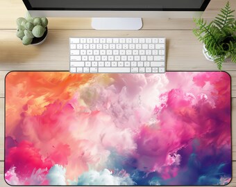 Puede incluir: Un tapete de escritorio con un diseño abstracto colorido con nubes rosadas, naranjas, azules y blancas sobre un borde negro.