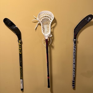 Hockey stick wall mounts