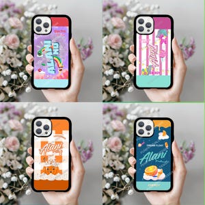 May include: A white ceramic mug with a black handle and the text "But First, Coffee" in a bold, black font. The mug is set against a blurred background, highlighting its clean design.