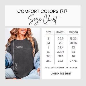 May include: A Comfort Colors 1717 size chart for a unisex tee shirt. The graphic displays a table with sizes S through 3XL, listing length and width measurements in inches. A visual guide shows a dark gray t-shirt with dashed lines indicating length and width.