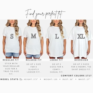 May include: A size chart for Comfort Colors 1717 t-shirts showing four fits: regular, relaxed, loose, and oversized. The image displays four white t-shirts labeled S, M, L, and XL with text explaining sizing options and model stats: 5'5" height, 130 lbs, 36" bust, 27" waist.