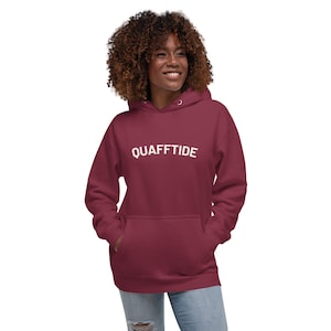 May include: A maroon hoodie with a white print that says "QUAFFTIDE" on the front.