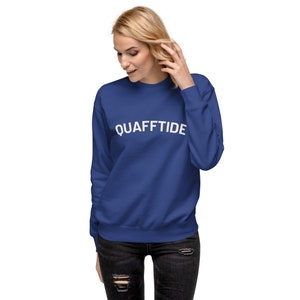 May include: A royal blue sweatshirt with the text "QUAFFTIDE" in white lettering.