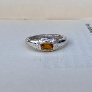 Silver ring set with synthetic yellow sapphire