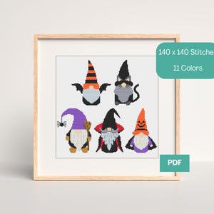 May include: A framed cross-stitch pattern featuring six Halloween gnomes. The gnomes have various hats and outfits in orange, black, purple, and white. The image includes text that reads "140 x 140 Stitches" and "11 Colors". A PDF icon is also visible.