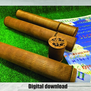 May include: Wooden scroll case set with a decorative lid, featuring the inscription "8 March". The set includes several rolled scrolls and a cylindrical container. The background is a green surface with a blue and white paper with text.