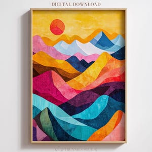 May include: Abstract landscape art print featuring a vibrant mountain range in shades of pink, orange, blue, and yellow. A red sun is in the yellow sky. The artwork is framed in a light wood frame and labeled "DIGITAL DOWNLOAD".