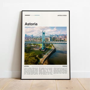 May include: A framed poster featuring a scenic view of Astoria, Oregon, with a large bridge spanning a river. The poster includes the text "Astoria" and "United States" in a minimalist design. The image showcases a cityscape and natural landscape.