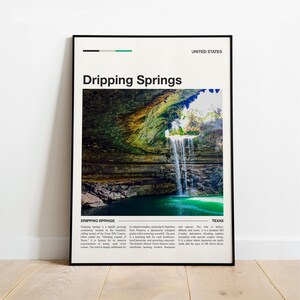 May include: A framed poster featuring a photograph of Dripping Springs, Texas, with a waterfall cascading into a turquoise pool. The poster includes the text "Dripping Springs" and "United States". The image is in a black frame.