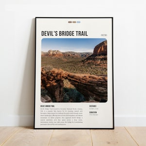 May include: A poster featuring a photograph of a natural sandstone arch bridge in a desert landscape. The poster includes the text "Devil's Bridge Trail" and "Arizona".