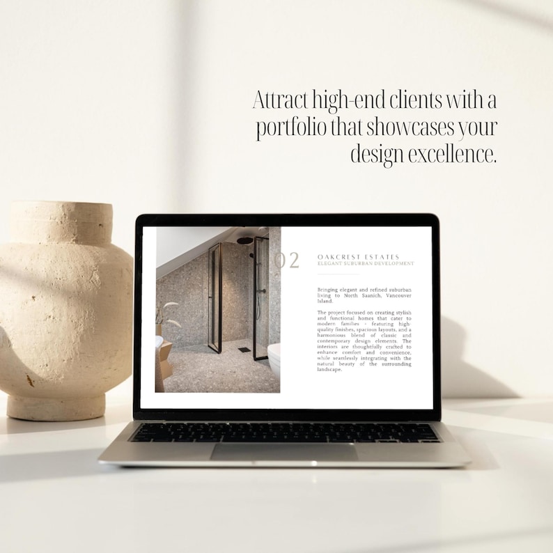 May include: A laptop computer displaying a website with a photo of a modern bathroom with a glass shower door and a text description about Oakcrest Estates, an elegant suburban development. The text reads "Bringing elegant and refined suburban living to North Saanich, Vancouver Island."