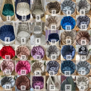 May include: A collection of 33 different round and oval-shaped cushions in various colors and textures. The cushions are arranged in rows and columns, with each cushion numbered. The cushions are likely for use in a baby or newborn photography studio.
