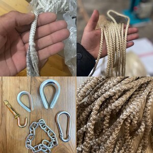 May include: A close-up of a set of metal hardware for hanging a hammock. The set includes two metal rings, a chain, a hook, and a screw-in eye bolt. The hardware is silver in color.