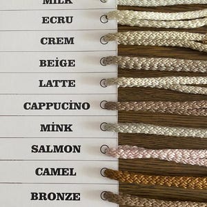 May include: A color chart with 12 different shades of cord, ranging from white to brown. The colors are labeled with their names in English and Turkish.