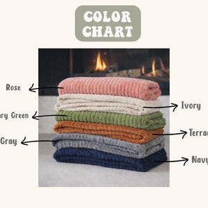 May include: A stack of corduroy blankets in various colors, including rose, ivory, military green, terracotta, gray, and navy. The image includes a color chart with the text "COLOR CHART".
