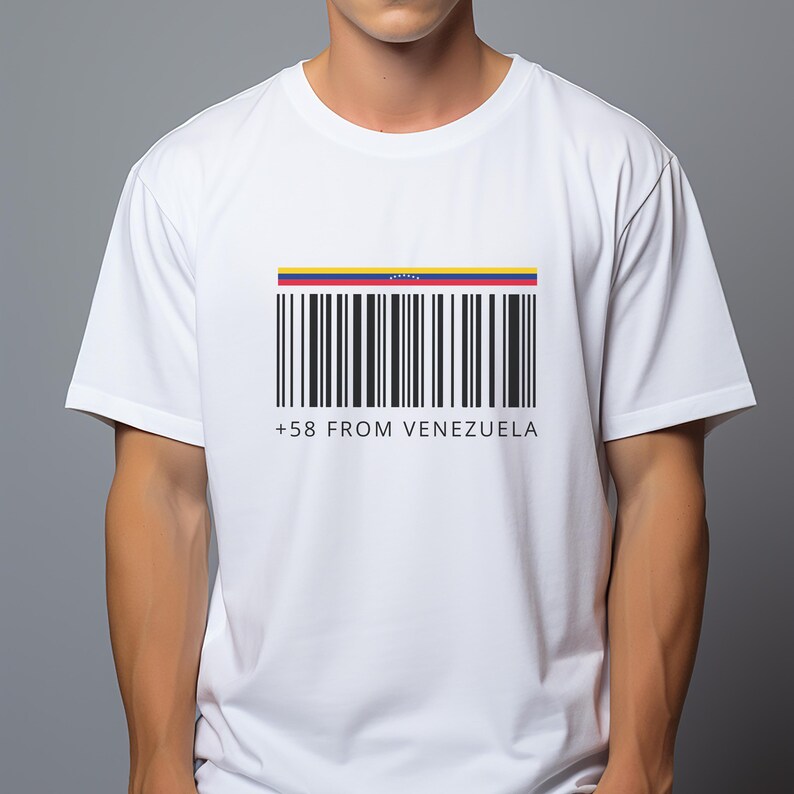 May include: White t-shirt featuring a barcode design with the colors of the Venezuelan flag at the top. Below the barcode are the words "+58 FROM VENEZUELA" in black text. The shirt is short-sleeved.