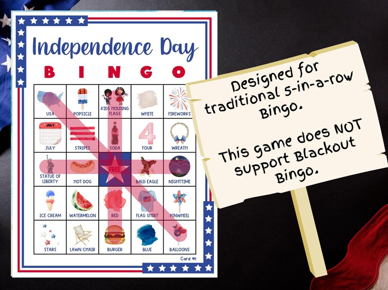 May include: Independence Day Bingo game card with red, white, and blue patriotic themed images. The card includes images of fireworks, the Statue of Liberty, and a hot dog. A sign states the game is designed for traditional 5-in-a-row Bingo.