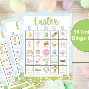 May include: A set of 50 unique Easter Bingo cards with a blue and white background. Each card has a 5x5 grid with images of Easter-themed items like chicks, carrots, eggs, and bunnies. The text "Easter Bingo" is at the top of the card.