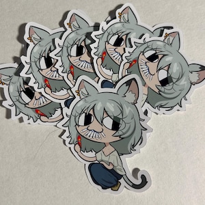 May include: A collection of die-cut stickers featuring a cartoon character with gray cat ears and hair. The character has a row of white cigarettes in their mouth and holds a red lighter in one hand, wearing a light shirt and dark pants.
