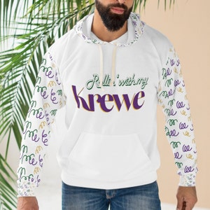 May include: White hoodie with a purple and gold "Rollin' with my Krewe" graphic on the front. The sleeves have a repeating pattern of green and gold "Krewe" text.
