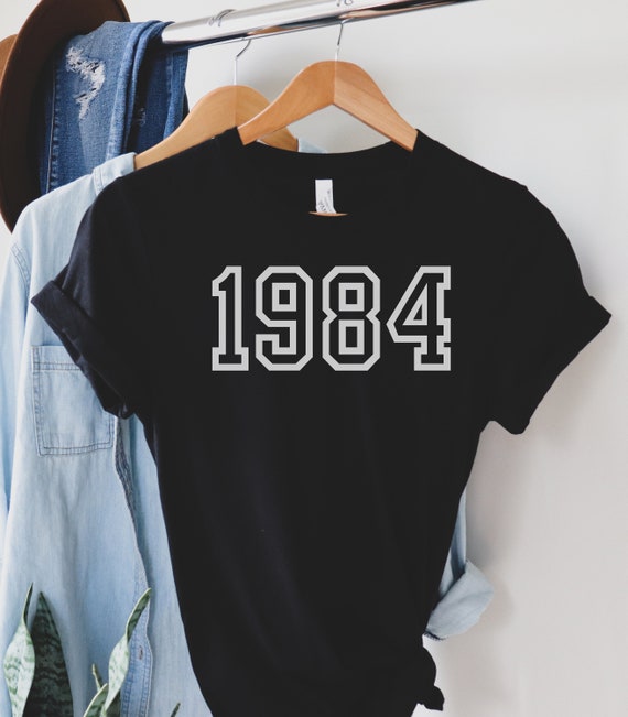 トップス 10th Anniversary Logo Embroidery Tee 36 10th Anniversary T-Shirt (Double Sided) — Decades