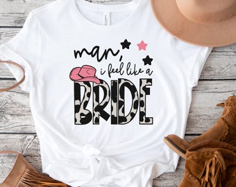 Man, I Feel Like A Bride Cow Print T-Shirt | Disco Cowgirl | Bride | Pink Cowgirl