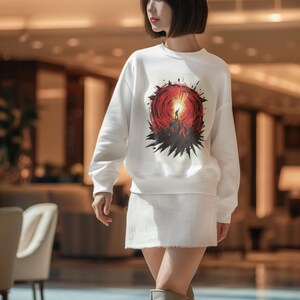 Sudadera "Soy invencible": jersey gráfico blanco, cuello redondo con mensaje de confianza y diseño de rayos de sol llamativos.