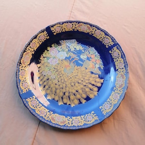 Vintage Moroccan Peacock Plate: Blue Porcelain with Golden Details