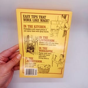 May include: A vintage yellow book cover with the title "EASY TIPS THAT WORK LIKE MAGIC!". The cover features illustrations and text offering cleaning tips for the kitchen, living room, workroom, and laundry room.
