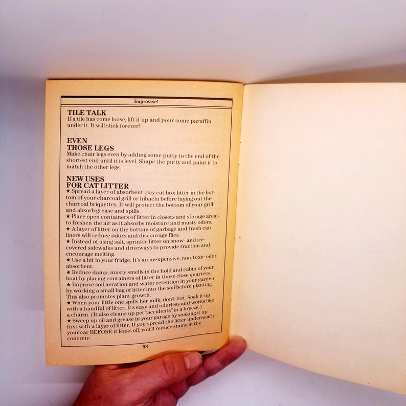 May include: Open book page with text titled "TILE TALK" and "NEW USES FOR CAT LITTER". The text provides tips for home improvement and cleaning, including using cat litter for various purposes. The page is yellowed with age.