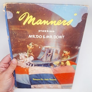 May include: Vintage book cover titled "Manners" starring Mr. Do & Mr. Don't. The cover features illustrations of two elf-like characters, a carriage pulled by white horses, and the text "Pointers For Little Persons". The background is a colorful patchwork.