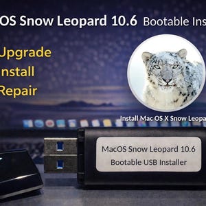 May include: A black USB flash drive labeled MacOS Snow Leopard 10.6 Bootable USB Installer with a detached cap. The background features text reading MacOS Snow Leopard 10.6 Bootable Installer, Upgrade, Install, Repair, and a snow leopard image.