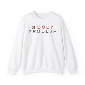May include: White crew neck sweatshirt with the text "3 BODY PROBLEM" printed across the chest. The word "BODY" is in red, while the other words are in black. The sweatshirt has long sleeves and a relaxed fit.