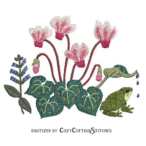 Könnte beinhalten: Stickerei mit rosa Alpenveilchen, grünen Blättern, blauen Blüten und einem grünen Frosch mit einer Gießkanne. Das Design wurde von CozyCottageStitches digitalisiert.
