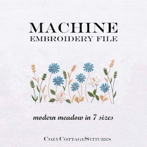 May include: A white background with the text "MACHINE EMBROIDERY FILE" in black. Below is a floral embroidery design featuring blue and white flowers, green leaves, and wheat stalks. The text "modern meadow in 7 sizes" is below the design.