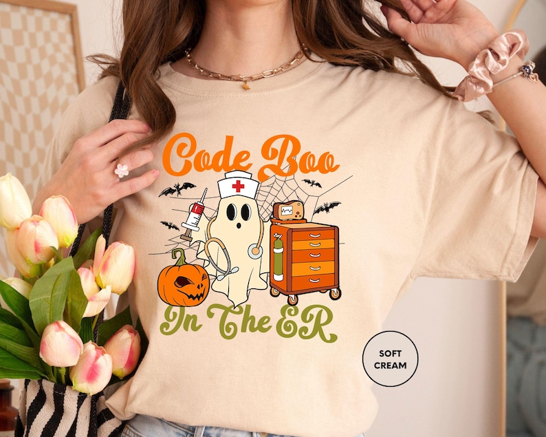 a woman wearing a t - shirt with a ghost on it