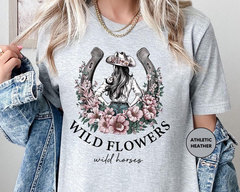 a woman wearing a t - shirt that says wild flowers