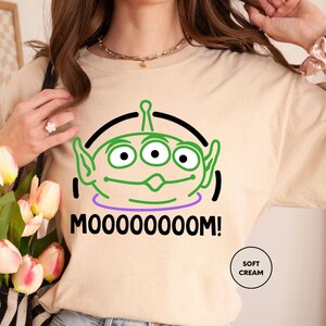 a woman wearing a t - shirt that says mooooooooooooo