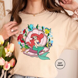 a woman is holding a bouquet of flowers