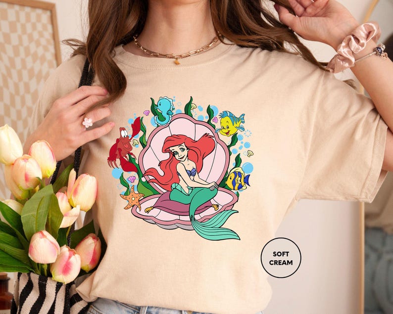 a woman is holding a bouquet of flowers