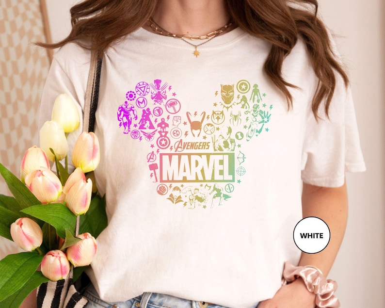 a woman holding a bouquet of tulips wearing a mickey mouse t - shirt