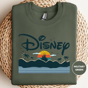 a t - shirt with the disney logo on it