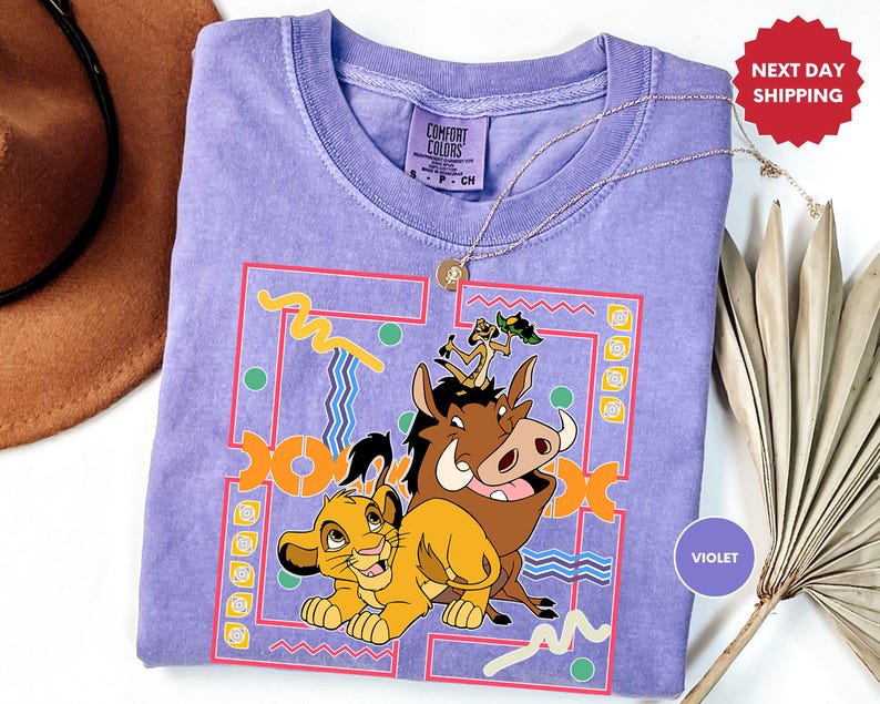 a t - shirt with a picture of the lion and the mouse on it