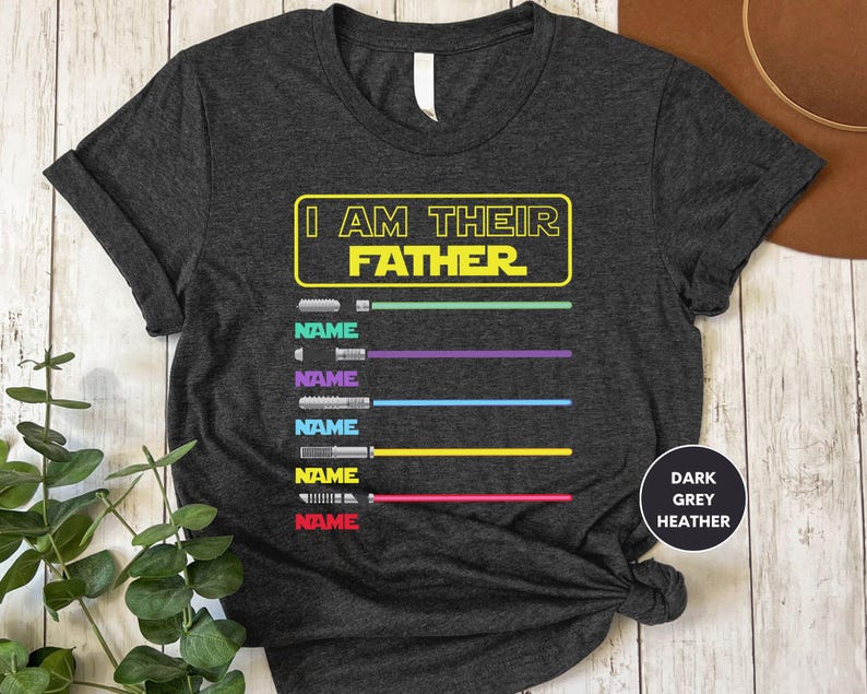 a t - shirt with the words i am the father on it
