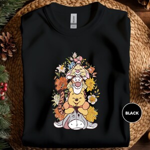 a black shirt with a cartoon character on it