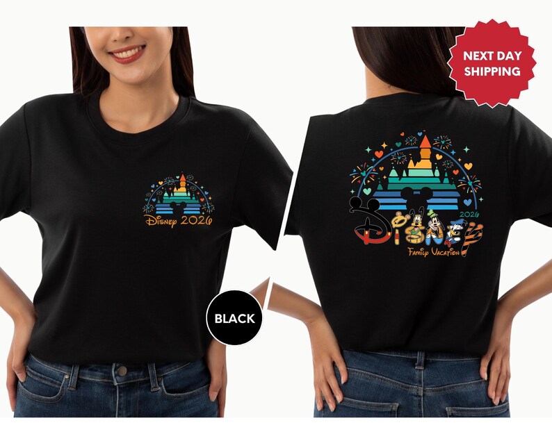 A woman wearing a black t-shirt with a Disney-themed design on the back.