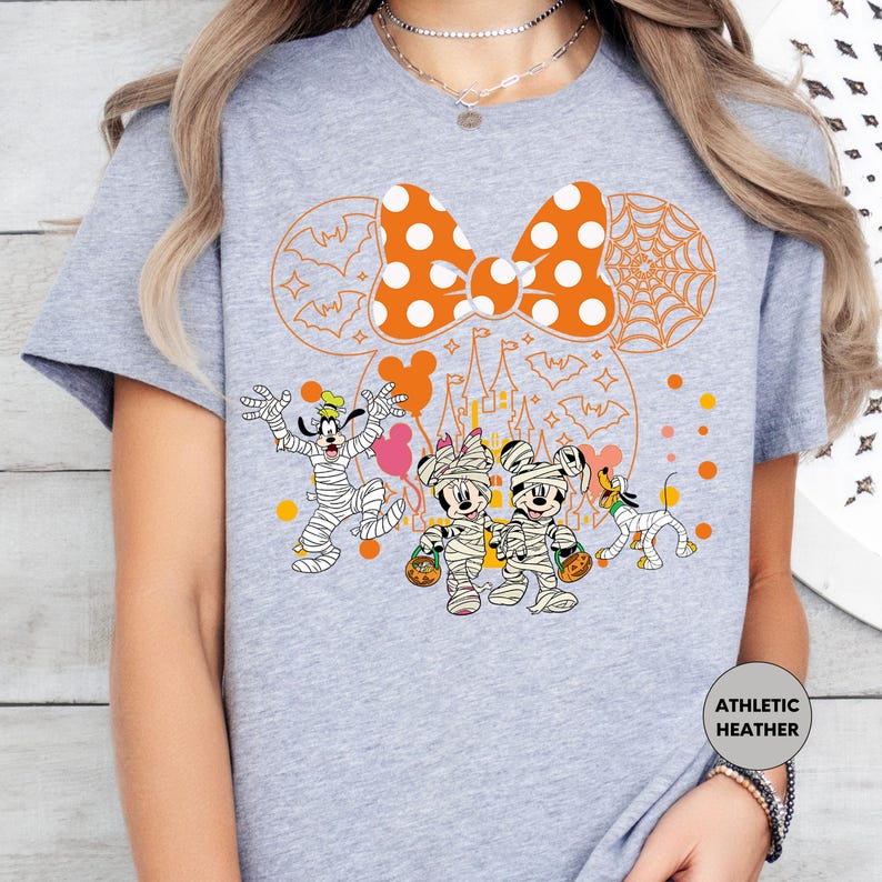 a woman wearing a mickey mouse t - shirt